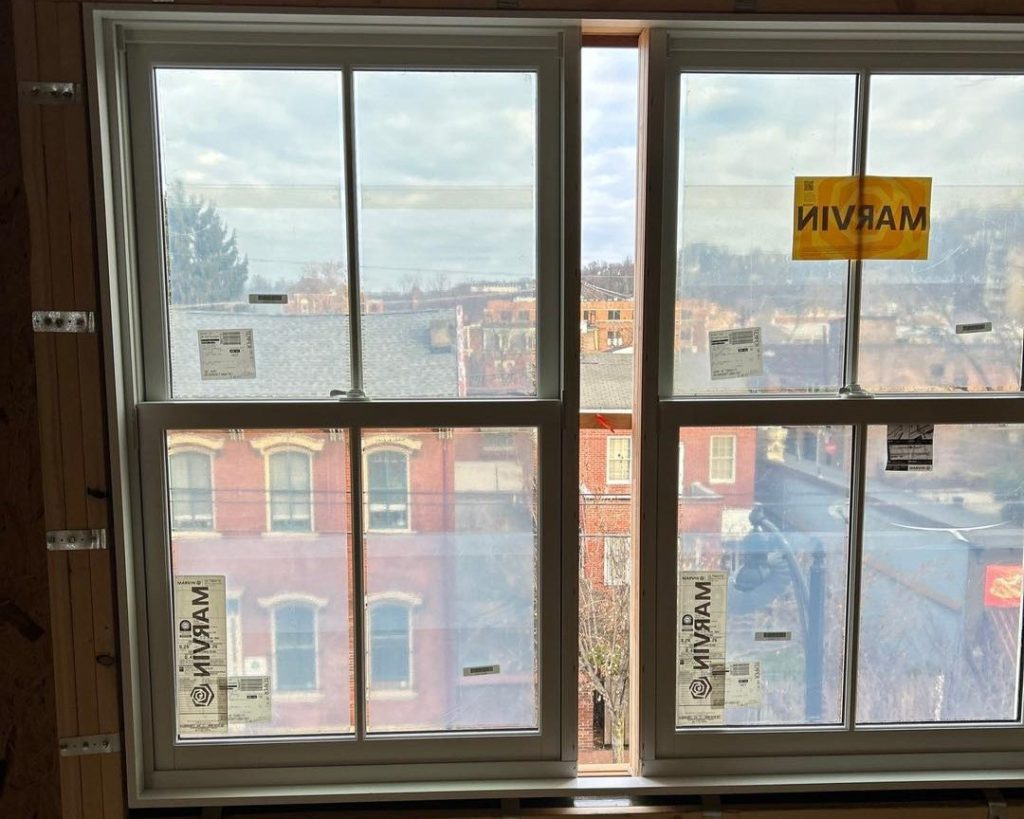 Two unfinished windows overlook a view of North Shore, Pittsburgh in this project.